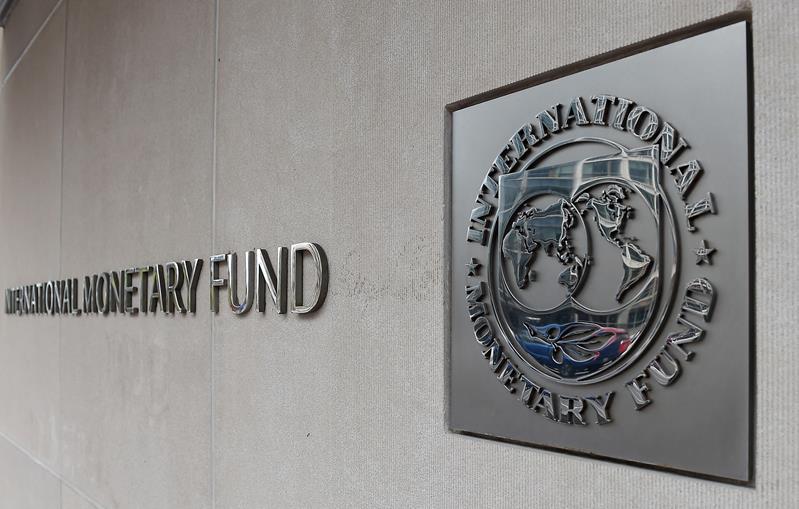 An exterior view of the building of the International Monetary Fund (IMF), with the IMG logo, is seen on March 27, 2020 in Washington, DC. (Photo by OLIVIER DOULIERY/AFP via Getty Images)